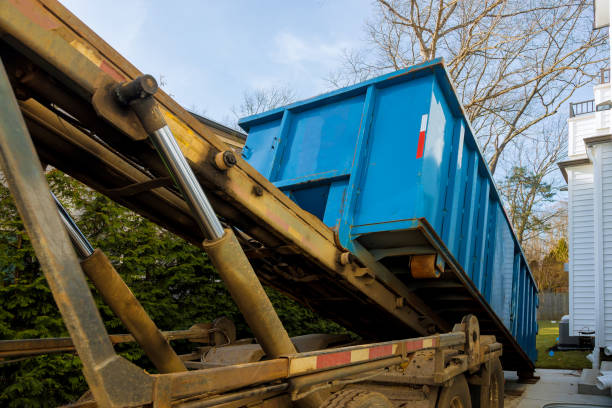 istock Unloading empty dumpster residential view of new houses being built and construction garbage 1194906160