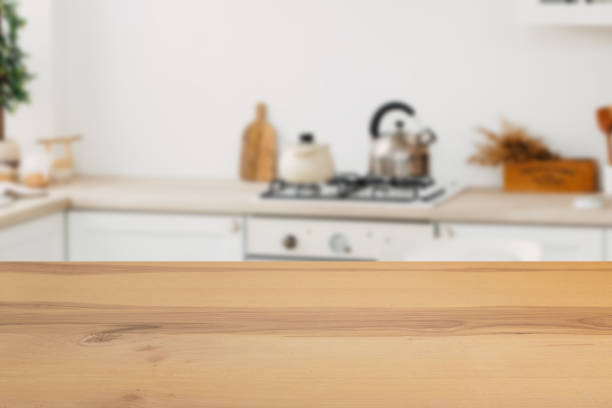 istock Wooden board empty table in front of a blurred background. Perspective brown wood with a blurred background of the kitchen and kitchen equipment - can be used to demonstrate or assemble your products. 1194908502