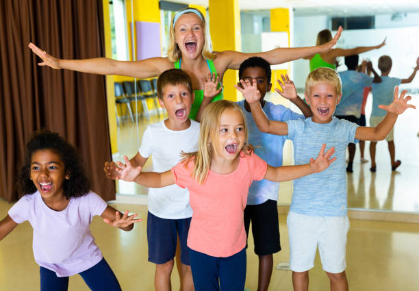 istock Positive children in dance studio smiling and having fun 1194908575