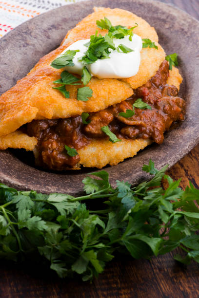 istock Potato pancakes with meat, vegetable, tomato and parsley 1194908580