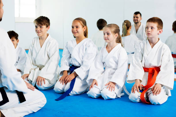 istock Children enjoying their trainings with coach at karate 1194908702