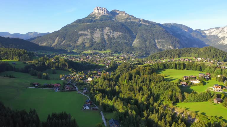 Aerial Drone Movie of Village, mountain and Lake around Hallstatt Village, Austrian Alps, Upper Austria, Europe