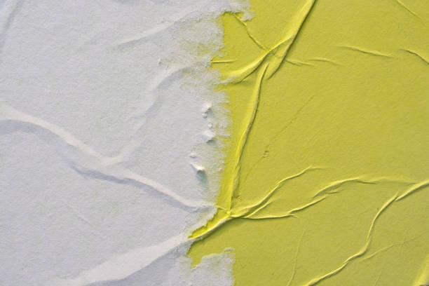 Yellow and white crumpled paper. Abstract background.