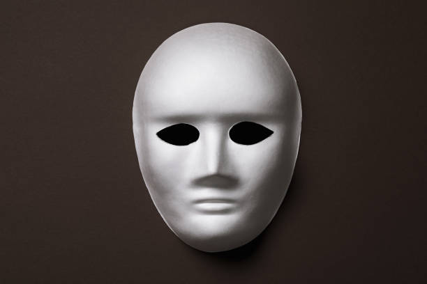 istock White mask on a dark background, top view 1194910162