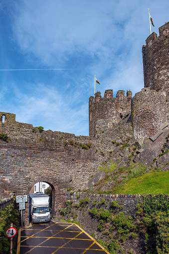 Conwy Castle, North Wales, UK - October 20, 2019: tight squeeze through the castle gates.
