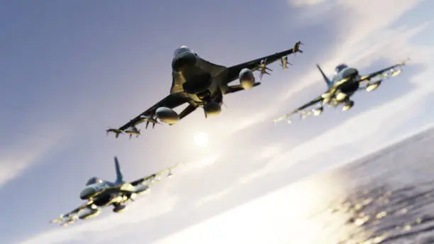 Three F-16 fighting falcon jets over the ocean flying together in vic formation 3d render