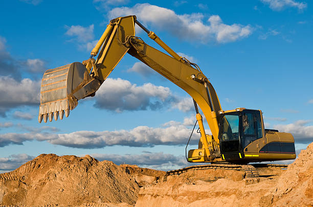 track-type loader excavator at sand quarry stock photo
