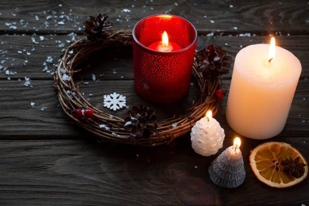 istock Christmas wreath and candles on dark background. 1194915545