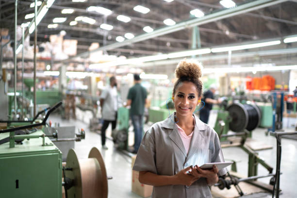 istock Woman using digital tablet in the industry portrait 1194915573