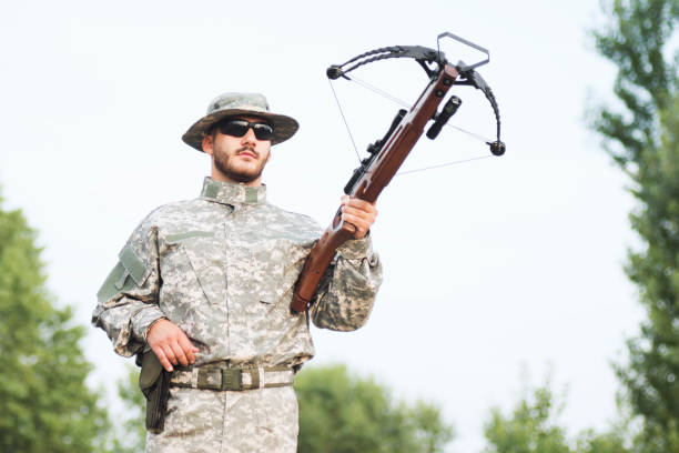 istock military person holding crossbow weapon 1194915843