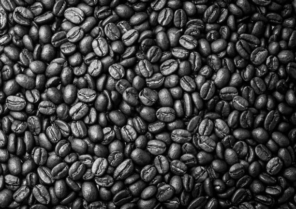 istock Pile of coffee beans on a white background 1194917680