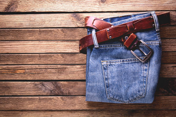 istock light blue jeans on old wooden background 1194919160