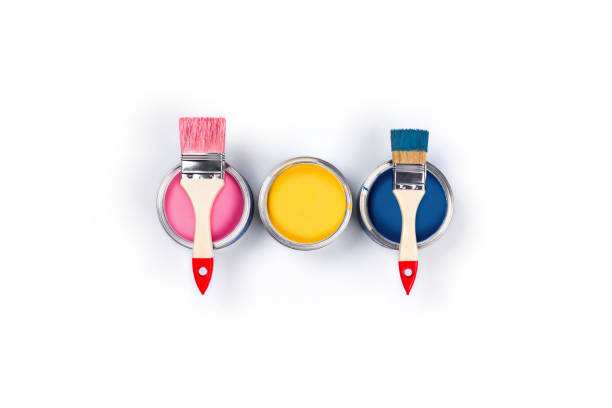 White background with three colored paint jars and brushes.