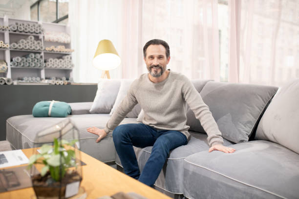istock Man in light sweater and jeans feeling good 1194922534