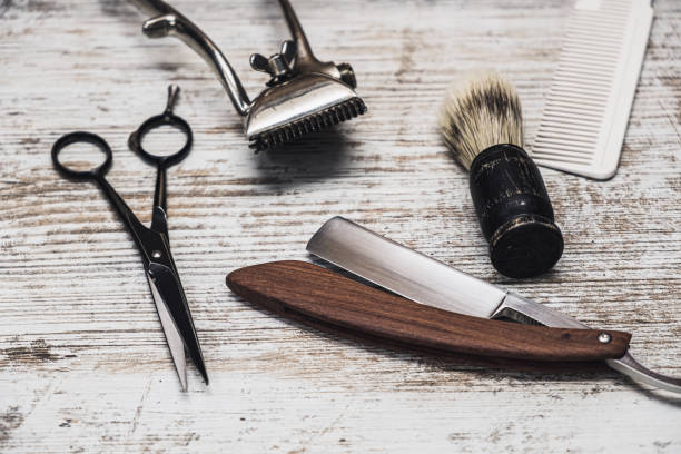 istock vintage barber tools dangerous razor hairdressing scissors old manual clipper comb shaving brush 1194924357