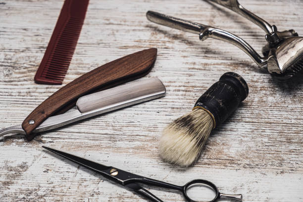 istock vintage barber tools dangerous razor hairdressing scissors old manual clipper comb shaving brush 1194925372