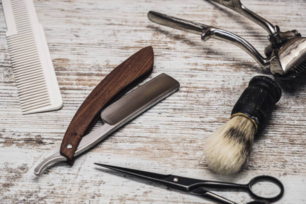 istock vintage barber tools dangerous razor hairdressing scissors old manual clipper comb shaving brush 1194925425