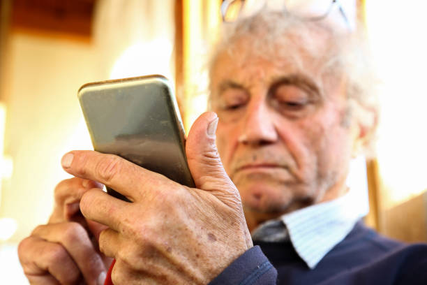 istock Close up Shot of Senior Man Using Mobile Phone 1194926862