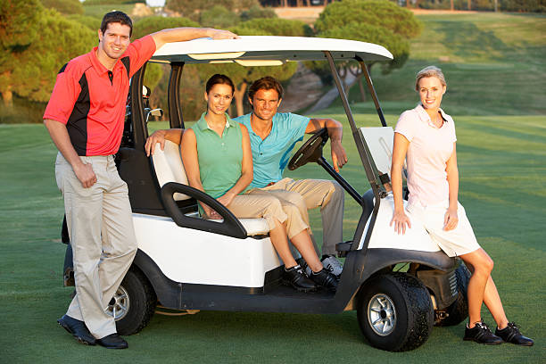 istock Friends Riding In Buggy On Golf Course 119492872