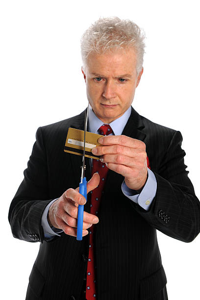 istock Man Cutting Credit Card 119492927