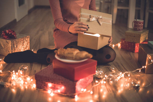 istock Woman enjoys Christmas decoration 1194931119