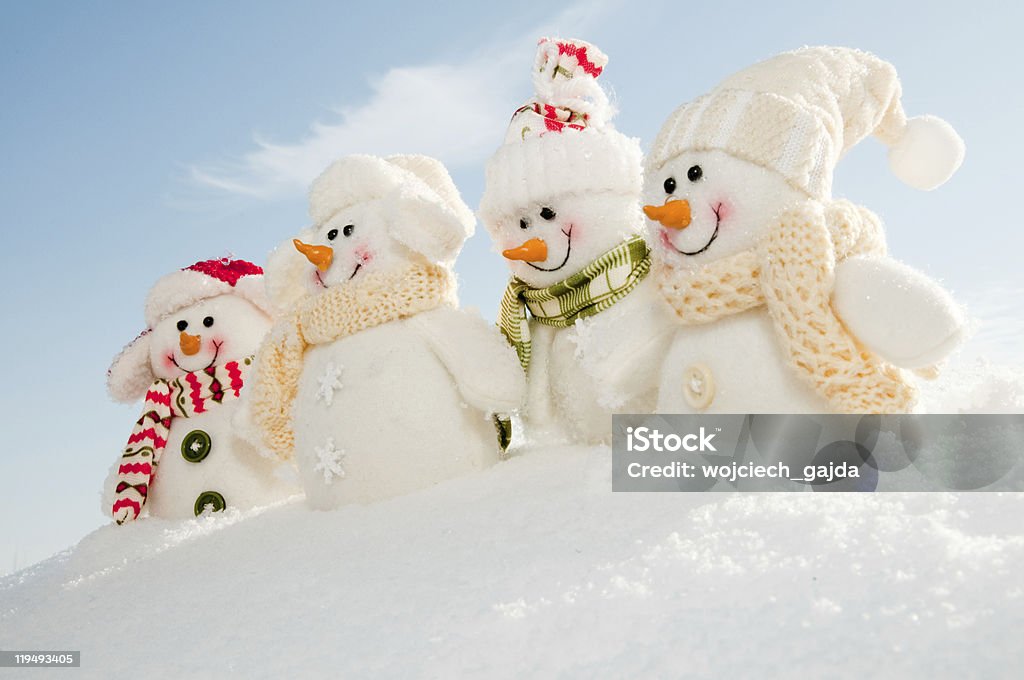 Diorama of snowmen holding hands Happy snowman friends in snow - no name toy Backgrounds Stock Photo