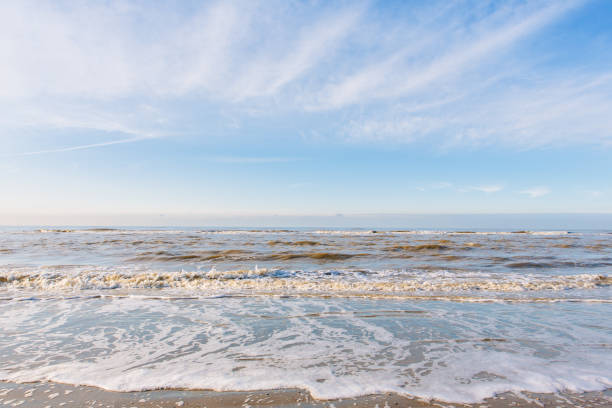 North Sea Netherlands Winter sunny day at the beach. Netherlands. north sea waves stock pictures, royalty-free photos & images