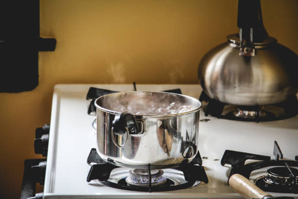 istock Brown eggs boiling in a small pot on the stove 1194937241