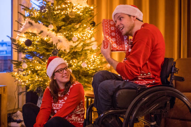 istock Christmas sweaters for disabled couple in xmas home 1194938426