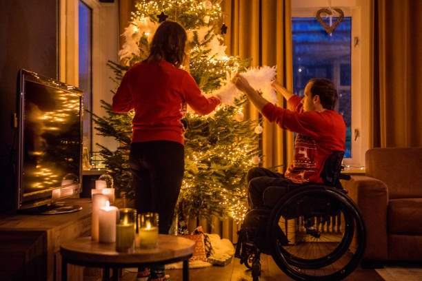 istock Christmas sweaters for disabled couple in xmas home 1194938549