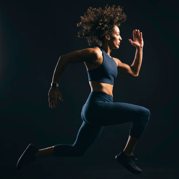 istock Fit Woman Jumping 1194940228
