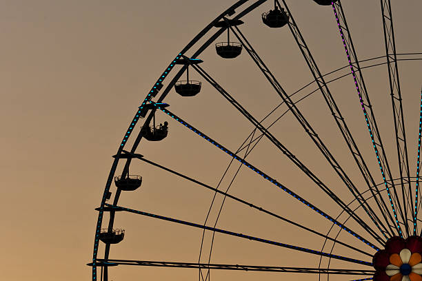 Ferris wheel at sunset stock photo