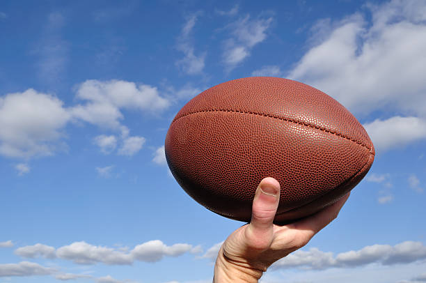 istock Quarterback Passing an American Football 119494101