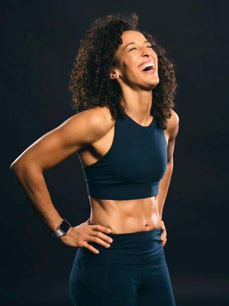 istock Fit Woman Against Black Background 1194942436