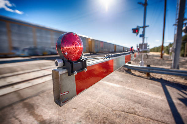 desert railroad crossing - railroad crossing train railroad track road sign stock-fotos und bilder