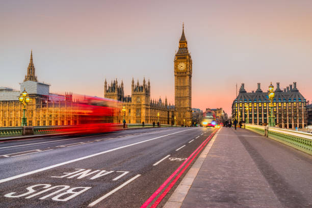 Blurred bus on westminster bridge, London, UK. Blurred bus on westminster bridge, The Big Ben and  the House of Parliament on background, London, UK central london stock pictures, royalty-free photos & images
