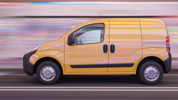 istock Side View of a Yellow Mini Van in Motion 1194944474