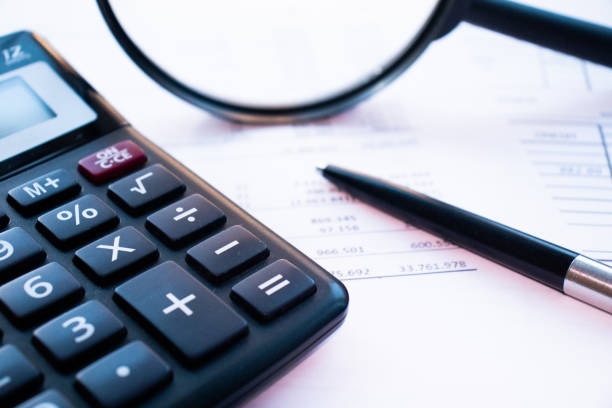 istock cost calculation is carried out on a calculator, large amounts 1194945321