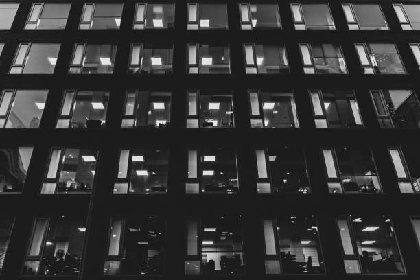 istock Facade of an office building illuminated in darkness 1194945336