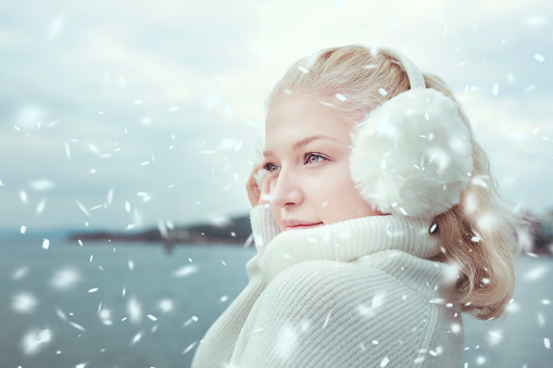 Cute adorable child having dun outside in snowy weather