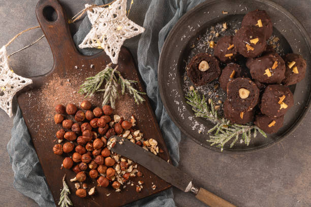 istock Dark chocolate truffles with hazelnuts on plate. Top view. Flat lay 1194952640