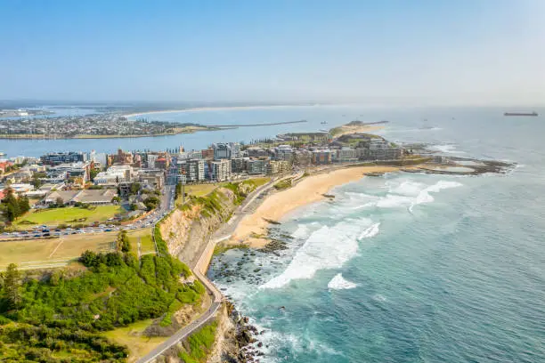 Newcastle Beach, NSW, Australia.  Newcastle is the second most populated area in the Australian state of New South Wales.  Located at the mouth of the Hunter River, it is famous for its coal and is the largest coal exporting harbour in the world.