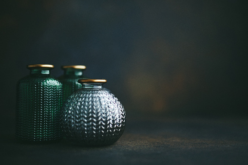 Still life background with small glass jars