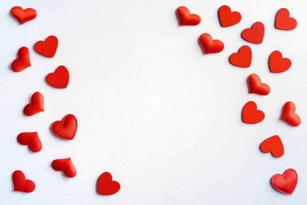 istock Festive composition from red hearts scattered on white background, valentines day concept, copy space for text 1194953536