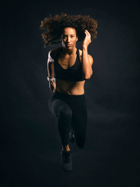 istock Fit Woman Jumping 1194953552