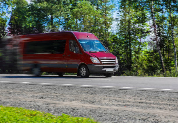istock Minibus goes on the country highway 1194954430