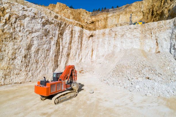 istock Red Excavator in a Quarry, Aerial Low Altitude View 1194955210