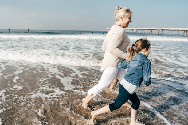 istock Family running on the beach 1194956071