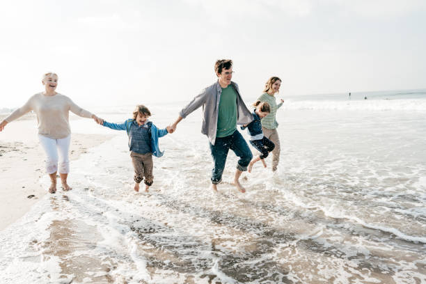 istock Three generation family on the beach 1194956076