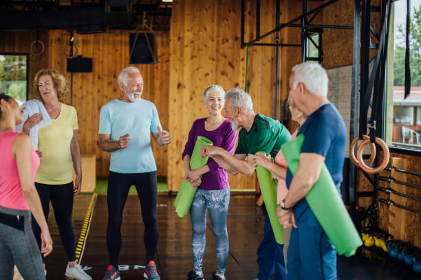 istock Group of seniors preparing for their group yoga class 1194956367